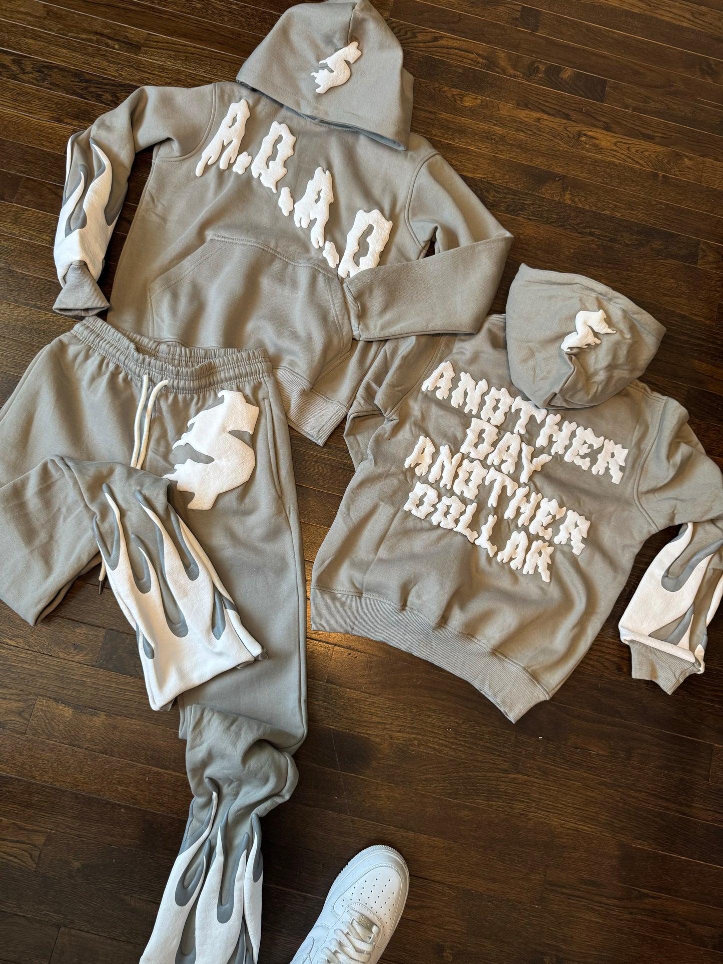 “Another day Another dollar” stacked sweatsuits